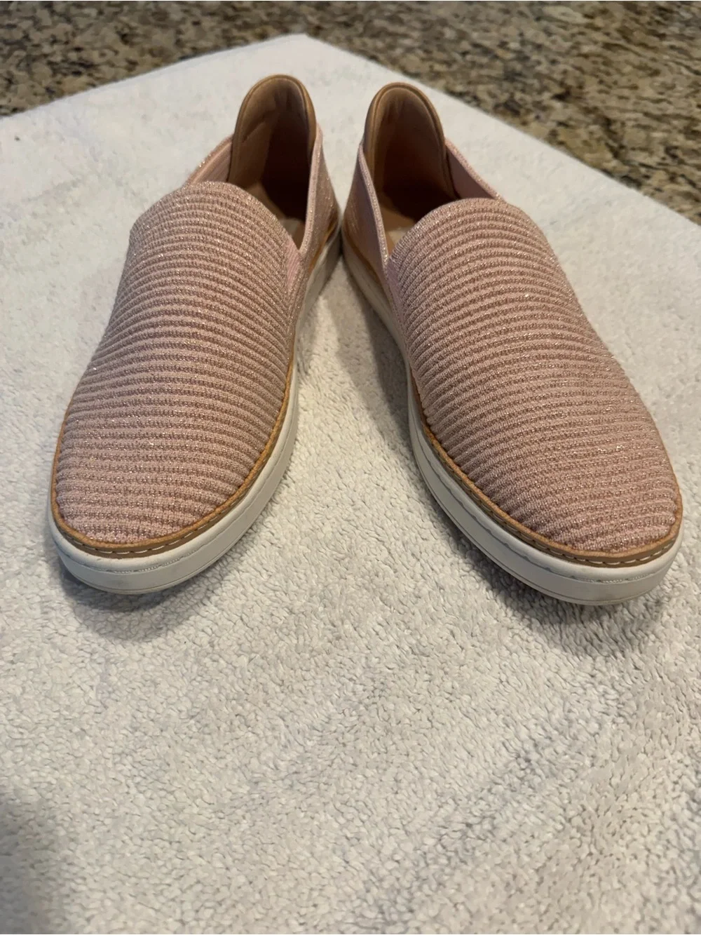 UGG Women's Slip-On Knit Flats in Blush Pink and has a beautiful glitter pink.